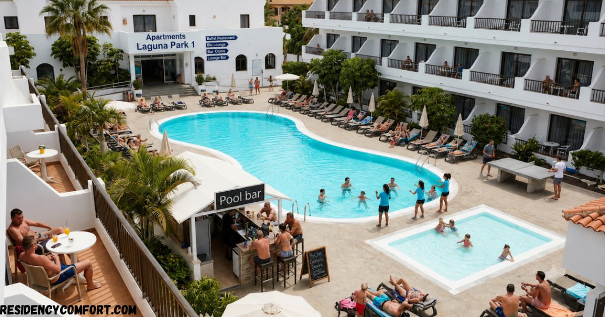 Apartments Laguna Park 1 featuring a spacious outdoor swimming pool, children's pool, pool bar, sun loungers, palm trees, and modern apartment buildings with guests enjoying a relaxing holiday.