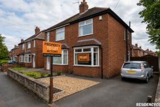Property to let in Stoke with a detached red-brick house, rental sign, driveway, and quiet residential street lined with trees.