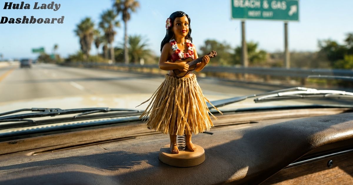 Hula Lady dashboard bobblehead playing a ukulele on a vintage car dashboard, with a sunny highway, palm trees, and a road sign in the background, featuring the text "Hula Lady Dashboard."